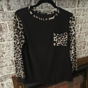 Black sweater with leopard sleeves